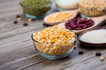 Corn in blow on a wood table background. corn seeds in blow 