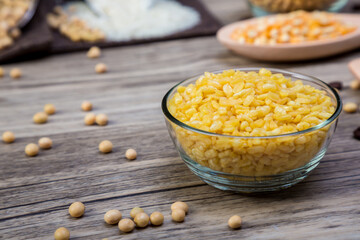 Organic split yellow mung beans in in blow. Split husked seeds of green gram, Mung dahl dried food ingredient. Traditional Indian deep fried.