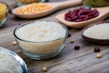 white rice or Thai Jasmine rice in  bowl on wood background. white rice grain in  bowl.