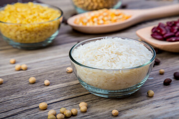 white rice or Thai Jasmine rice in  bowl on wood background. white rice grain in  bowl.