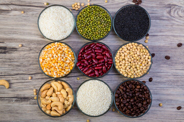 Cereal grains seeds beans on wooden background. Whole grains and bean. Cereals and beans. Different dry legumes for eating healthy