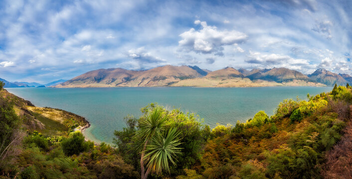 Lake Wanaka Lookout Panorama at the Neck with mountain peaks in the distance in Mount Aspiring National Park, Otago Region, New Zealand, Southern Alps.
