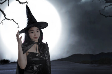 Asian witch woman with a hat standing