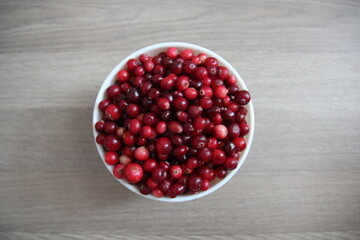
red cranberries in a white plate top view