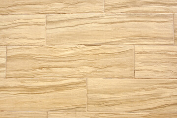 Beige tiles on the wall background