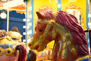 Carousel horses in an Amusement Park at Night Time