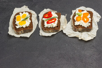 Appetizing bruschetta with various toppings on paper