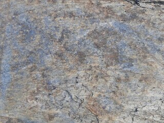 Natural background of rock in riverside india.  Stones texture and background. Rock texture. Rock fragment. Abstract background. A fragment of rock. 