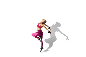 Fototapeta na wymiar Butterfly. Beautiful young female athlete practicing on white studio background, portrait with shadows. Sportive fit model in motion and action. Body building, healthy lifestyle, style concept.
