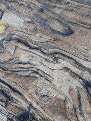 Natural background of rock in riverside india.  Stones texture and background. Rock texture. Rock fragment. Abstract background. A fragment of rock. 