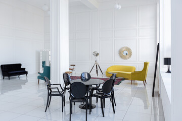 modern fashionable futuristic interior design of a spacious white hall with black and yellow furniture