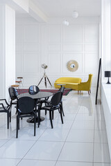 modern fashionable futuristic interior design of a spacious white hall with black and yellow furniture