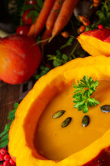 Delicious autumn pumpkin soup with baguette