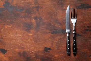 Wooden table with knife and fork