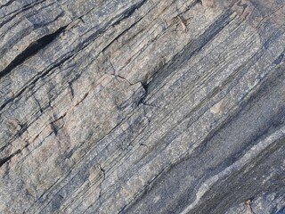 Natural background of rock in riverside india.  Stones texture and background. Rock texture. Rock fragment. Abstract background. A fragment of rock. 