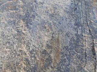 Natural background of rock in riverside india.  Stones texture and background. Rock texture. Rock fragment. Abstract background. A fragment of rock. 