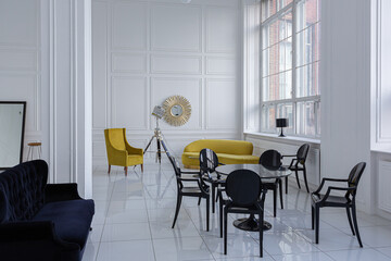 modern fashionable futuristic interior design of a spacious white hall with black and yellow furniture