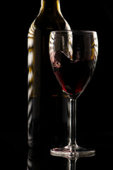 Naklejka na ściany i meble Detailed closeup macro photo of a glass of red wine, dark beverage background.
