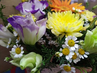 Fototapeta na wymiar Beautiful bright bouquet of chrysanthemum chamomile gerbera flowers