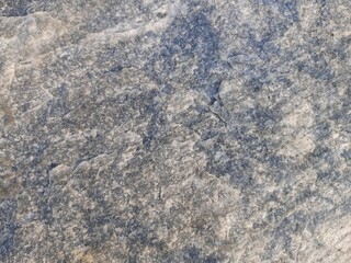 Natural background of rock in riverside india.  Stones texture and background. Rock texture. Rock fragment. Abstract background. A fragment of rock. 