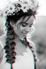portrait of smiling girl in white dress with floral wreath and braids in summer at sunset in the...