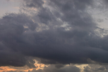 Abstract background of cloudy sunset sky golden hour.