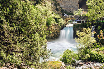 Fototapeta na wymiar Long exposure of Afqa waterfall in spring at daytime, Lebanon