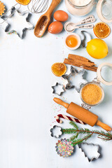 Ingredients for Christmas baking - flour, spices, eggs and cookie cutters.