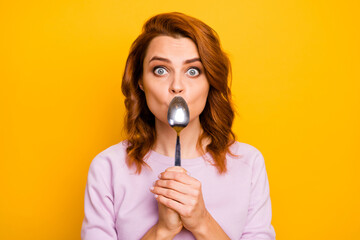 Portrait of shocked crazy woman close cover her mouth with spoon want eat dessert try healthcare...