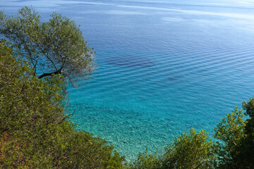 Beautiful turquoise paradise secluded pebble beach of Gidaki only accessible by path, Ithaki or Ithaca island, Ionian, Greece