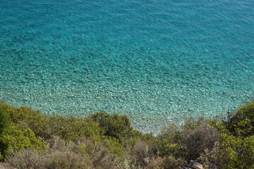 Beautiful turquoise paradise secluded pebble beach of Gidaki only accessible by path, Ithaki or Ithaca island, Ionian, Greece