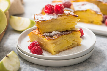 Piece of fresh baked homemade layered apple pie.