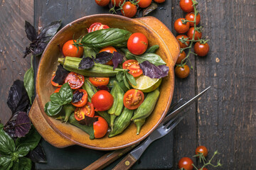 Traditional healthy organic Turkish food Okra with tomato  and olive oil. Ready to eat.