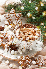Mug with hot chocolate  and gingerbread cookies on wooden table