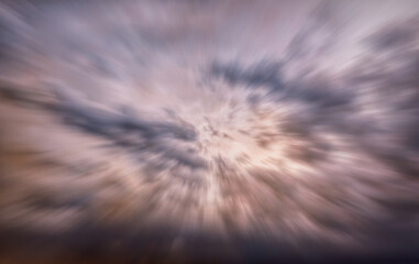 Light of the setting sun through the clouds