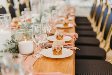 Beautiful wedding table setting decorated with flowers and candles