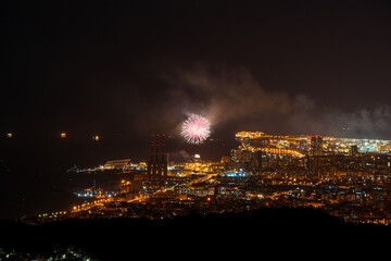 Fototapeta premium Final of the festival of La Mercè 2020 with fireworks distributed throughout the city of Barcelona in order not to generate crowds of people to avoid COVID-19.