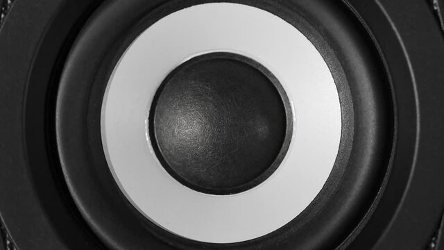 Black bass woofer. Modern speacker loud sound. Slow motion footage.