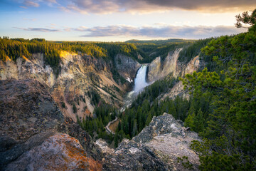 lower falls of the yellowstone national park at sunset, wyoming, usa