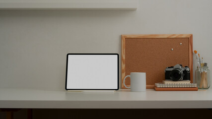 Mock up laptop computer in comfortable room with office supplies