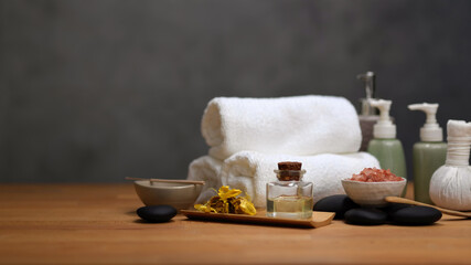 Spa table with spa accessories and copy space on wooden table