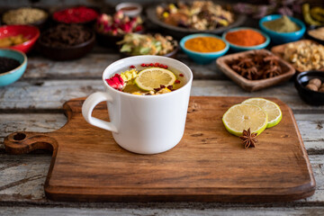 Large variety of multi colored dried tea leaves and flowers on the table