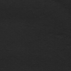 Black torn paper collage close-up. Texture made from various paper and cardboard parts. Damaged old paper background. Vintage blank wallpaper. Material design backdrop.