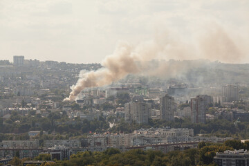 Fototapeta premium Smoke in the city from burning building