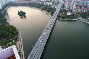 Fototapeta premium Aerial skyline view of Hanoi city, Vietnam. Hanoi cityscape by sunset period at Linh Dam lake, Hoang Mai district