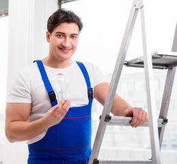 Contractor preparing the change the light bulb
