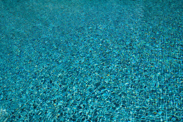 Water surface in the pool. Water is moving in the pool