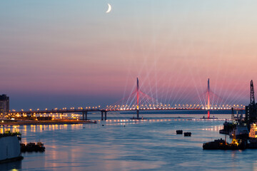 festive illumination over the bridge on Scarlet Sails celebration in St. Petersburg, Russia, in June 2020