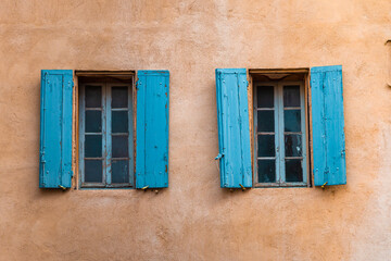 Two wooden windows of an old town