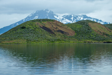 Beautiful Patagonian waterfall in a forest lit by the rising sun of Patagonia